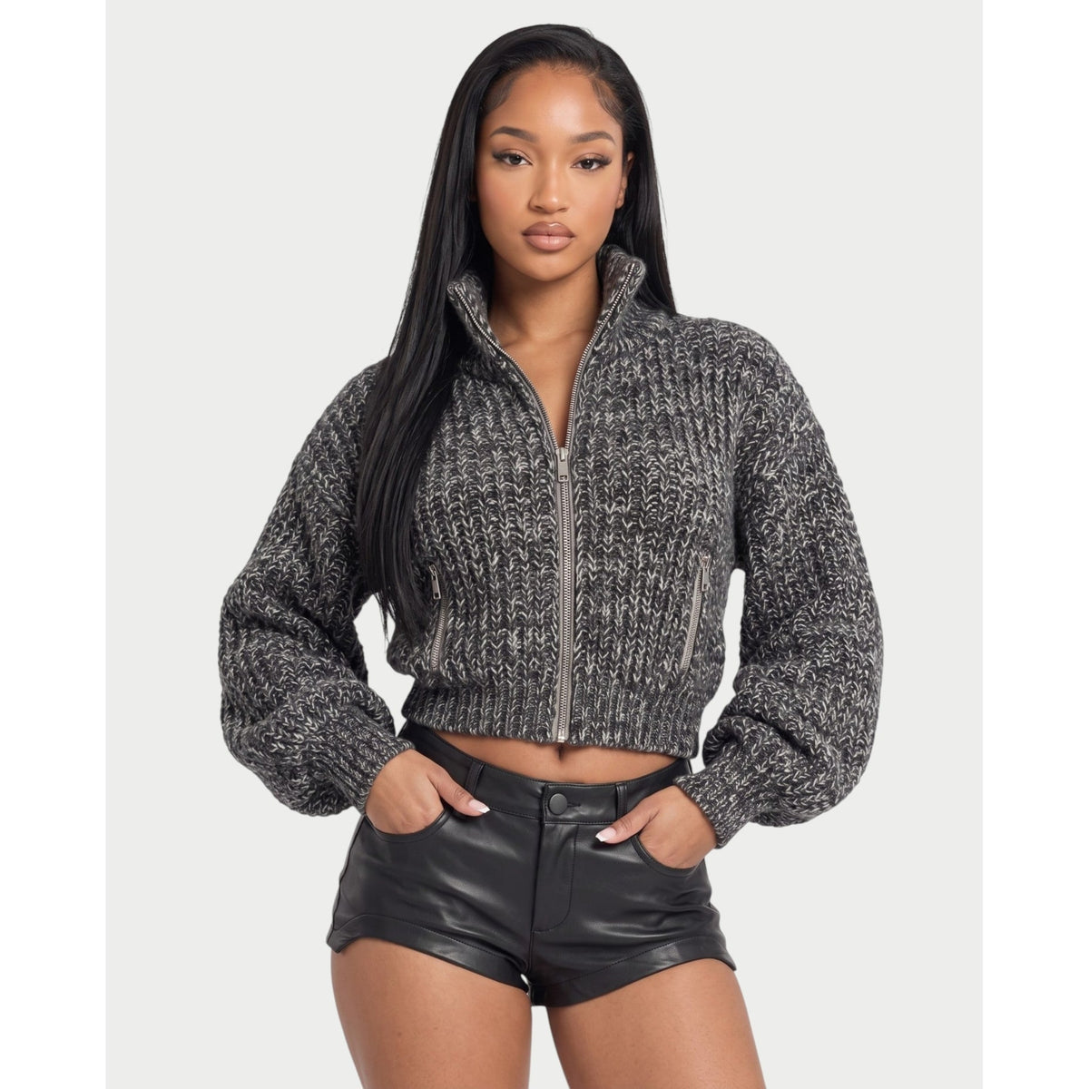 Die Strickjacke mit Stehkragen und Reißverschluss