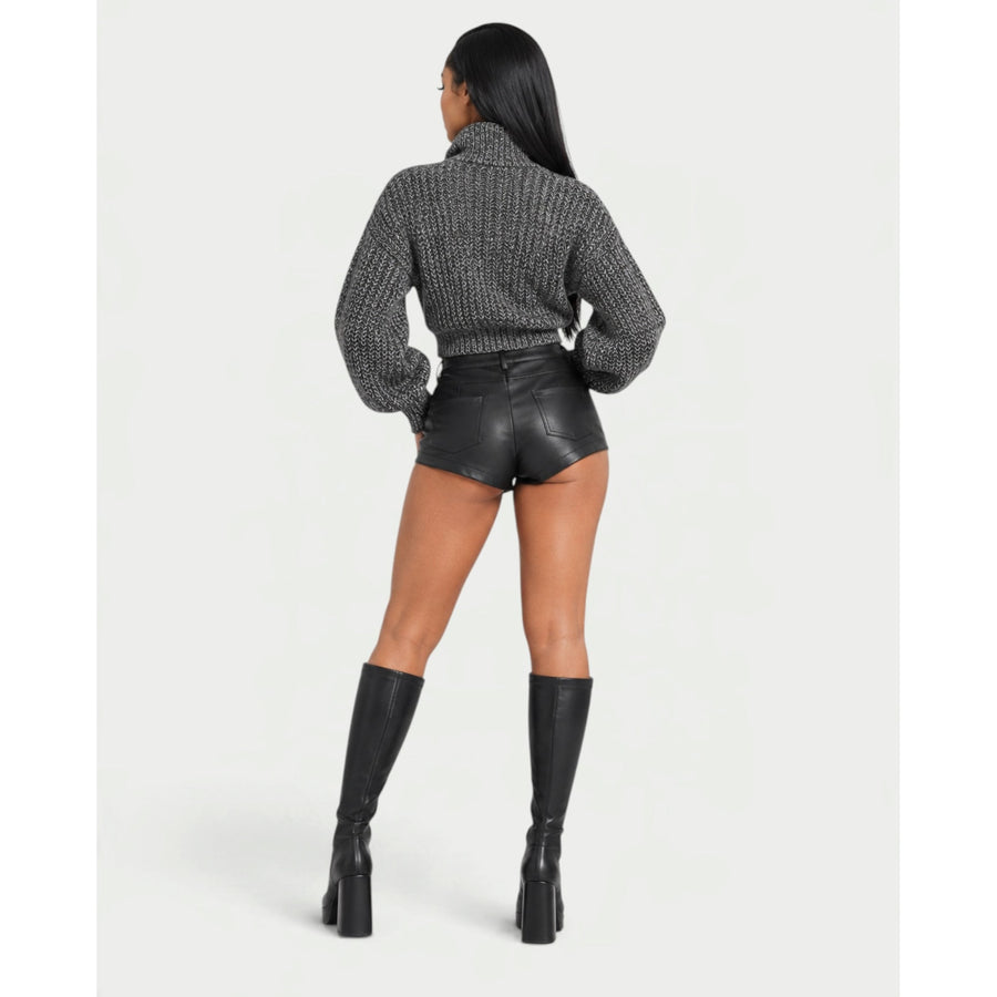 Die Strickjacke mit Stehkragen und Reißverschluss